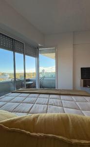 En eller flere senge i et værelse på Dpto TEMPORARIO ROSARIO SUNSET