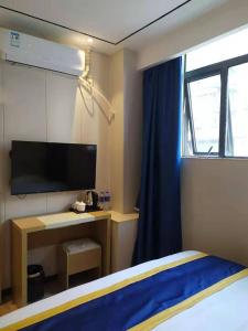 TV a/nebo společenská místnost v ubytování Longxiang intelligent Hotel