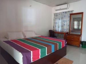 Voodi või voodid majutusasutuse Hotel Sea Shadow toas