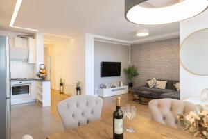 a kitchen and living room with a table and chairs at Luxury and Spa peaceful paradise in Makarska