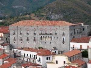 a large gray building with red roofs in a city at Montesanto 116 in Cosenza