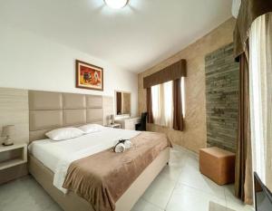 Postel nebo postele na pokoji v ubytování Imperial Hotel