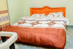 Ένα ή περισσότερα κρεβάτια σε δωμάτιο στο KWETU AIRPORT Residences&Suites