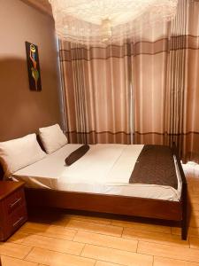 Ένα ή περισσότερα κρεβάτια σε δωμάτιο στο KWETU AIRPORT Residences&Suites