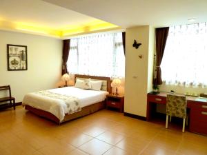Кровать или кровати в номере Zheng Da Homestay