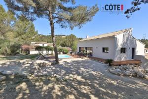 a villa with a pool and a house at Villa Concept in Ensuès-la-Redonne