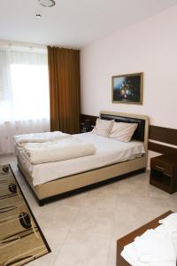Postel nebo postele na pokoji v ubytování Hotel & Restaurant Ida