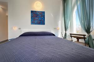 מיטה או מיטות בחדר ב-Hotel Meublè Agavi