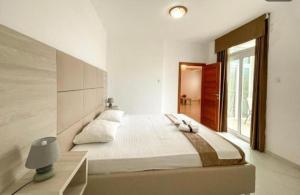 Postel nebo postele na pokoji v ubytování Imperial Hotel