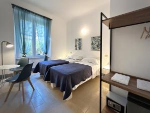 מיטה או מיטות בחדר ב-Hotel Meublè Agavi