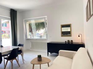 a living room with a couch and a table at CASA AL FARO - Anzio Centro in Anzio