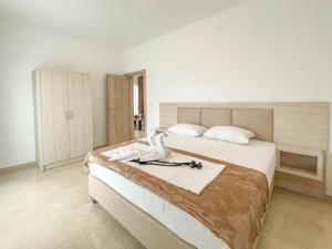 Postel nebo postele na pokoji v ubytování Imperial Hotel