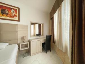 Postel nebo postele na pokoji v ubytování Imperial Hotel