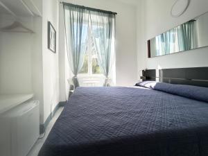 מיטה או מיטות בחדר ב-Hotel Meublè Agavi