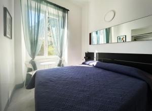 מיטה או מיטות בחדר ב-Hotel Meublè Agavi
