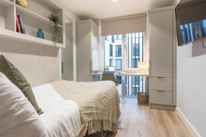 Postel nebo postele na pokoji v ubytování City HideAway