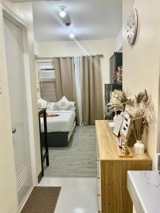 Ένα ή περισσότερα κρεβάτια σε δωμάτιο στο Vivaldi Residences near Roxas Night Market, Davao City