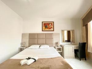 Postel nebo postele na pokoji v ubytování Imperial Hotel