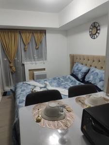 Voodi või voodid majutusasutuse Casa De Fe Staycation- Azure North Pampanga toas