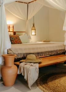 a bedroom with a bed with a canopy at Na Villa dos Algodões in Marau