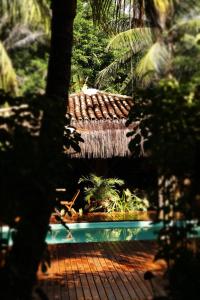 a view of a house in a jungle with trees at Na Villa dos Algodões in Marau