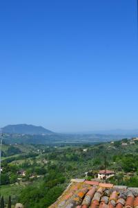 a view of a city from the roof of a building at Casa la Finestra sul Monte - Tamerò Estates in Poggio Mirteto