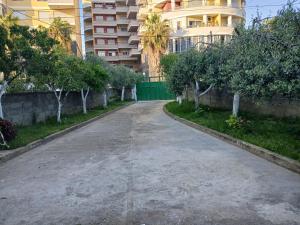 an empty street in front of a building at Arta room in Durrës