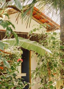 a building with plants in front of a window at Na Villa dos Algodões in Marau