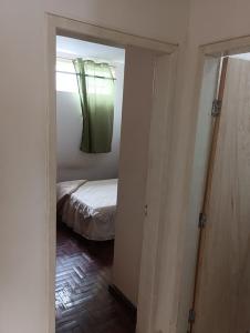 Postel nebo postele na pokoji v ubytování Casa quartos suítes