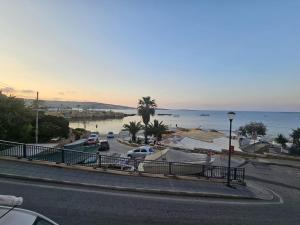 a street with a view of a beach and the ocean at Sea VIEW holiday home in St. Paul's Bay