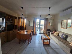 a living room with a couch and a table at Sea VIEW holiday home in St. Paul's Bay +3 photos