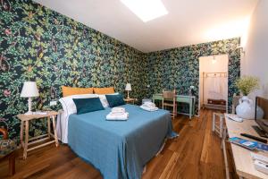 Postel nebo postele na pokoji v ubytování B&B Lu Cuccuviu