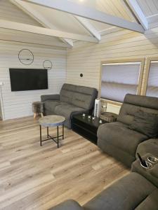 Χώρος καθιστικού στο Relaxing and cozy cottage with hot tub