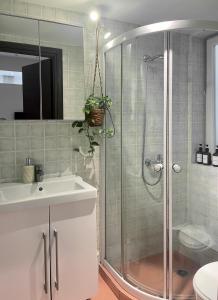 a bathroom with a shower and a sink at K8 Syntagma in Athens