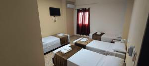 Postel nebo postele na pokoji v ubytování Hotel Emmanuel