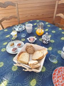 a table with bread and other food on it at Nouelig bras in Loctudy