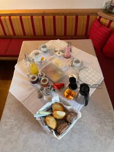 a table with a tray of breakfast foods on it at Haus Hager in Schlitters