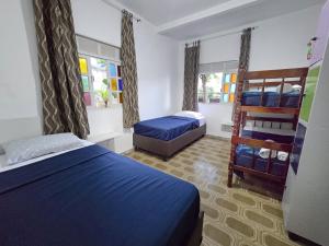 Postel nebo postele na pokoji v ubytování Hostel Chico Lessa