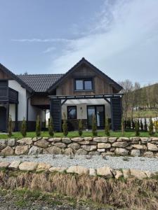 a house with a stone path in front of it at Domek na szlaku in Szklarska Poręba