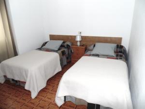 Posteľ alebo postele v izbe v ubytovaní APARTAMENTOS OUTEIRO