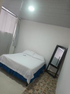 Postel nebo postele na pokoji v ubytování Apartahotel completo