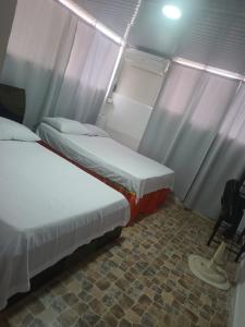Postel nebo postele na pokoji v ubytování Apartahotel completo
