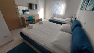 Posteľ alebo postele v izbe v ubytovaní Apartments Villa Alba
