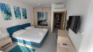 Posteľ alebo postele v izbe v ubytovaní Apartments Villa Alba