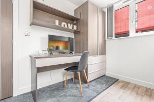 a study with a desk and a chair at Contemporary Comfort Steps from Ricoh Arena in Coventry +21 photos