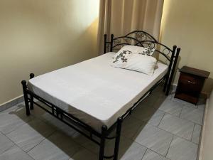 Postel nebo postele na pokoji v ubytování Nyumbani Abode