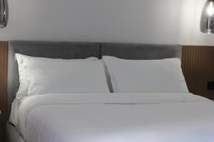 Postel nebo postele na pokoji v ubytování Compas Boutique Hotel