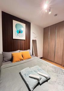 a bedroom with a bed with two towels on it at The Sos Staycation in Davao City +5 photos
