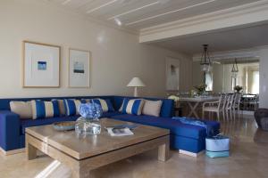 a living room filled with furniture and a coffee table at Anassa in Polis Chrysochous