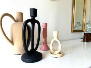 a group of different types of vases on a counter at La Chambre de Kerly in Pléguien